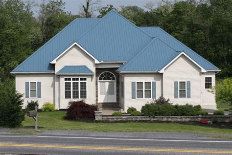 matching metal blue roof and door stone house|traditional blue roof houses.